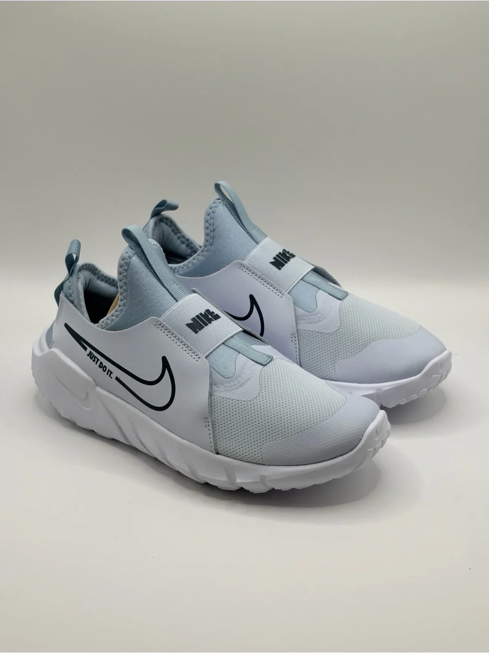 Nike 6Y/7.5W Light Blue and White Slip-On Sneakers with Navy Swoosh